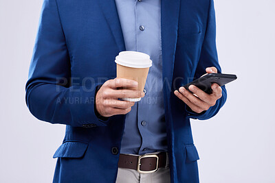 Buy stock photo Phone, coffee and closeup of businessman hands in studio typing message on social media, mobile app or the internet. Technology, cappuccino and lawyer scroll online with cellphone by white background