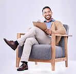 Thinking, smile and a man psychologist in a chair on a white background in studio to listen for diagnosis. Psychology, mental health and idea with a person counseling during a therapy session