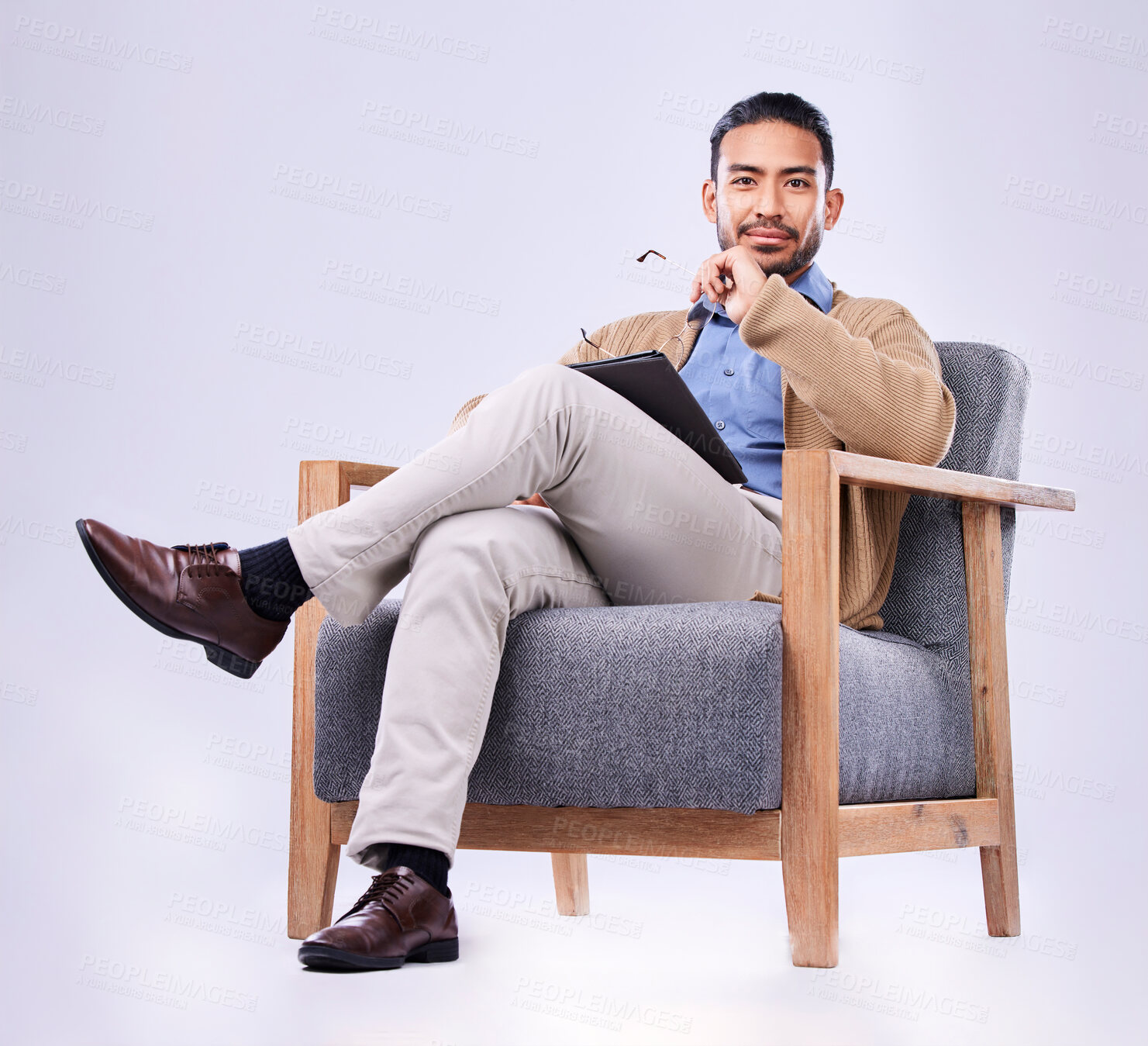 Buy stock photo Portrait, tablet and psychology with a man in a chair on white background in studio to listen for diagnosis. Psychologist mental health and listening with a person counseling during a therapy session