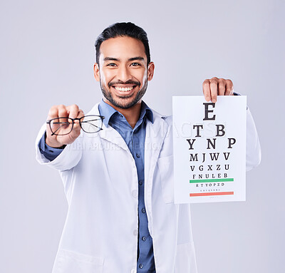 Buy stock photo Man, glasses and eye chart of optometrist in portrait at studio isolated on white background. Face, spectacles and happy ophthalmologist with snellen test document for vision, healthcare or wellness