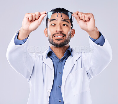 Buy stock photo Man, glasses and vision of ophthalmologist at studio isolated on a white background. Frame, spectacles and optometrist, doctor and medical professional with lens, healthcare or wellness of optician