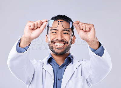 Buy stock photo Man hands, glasses and portrait of ophthalmologist at studio isolated on a white background. Frame, spectacles and happy face of optometrist, optician and doctor with vision lens, health and wellness