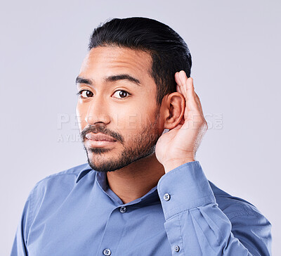 Buy stock photo Hands, ear and portrait of asian man in studio for gossip, listening or speak up sign on grey background. Hearing, secret and face of Japanese guy model with emoji icon for deaf, sign language or huh