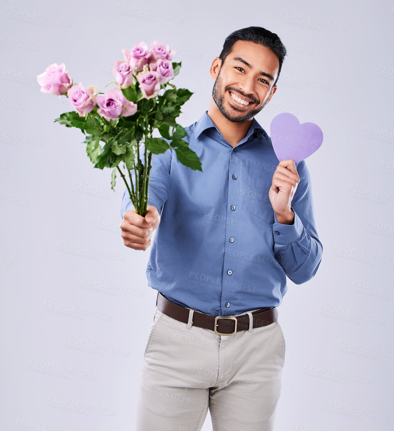 Buy stock photo Roses, portrait and asian man with purple heart in studio for thank you, gift or care on white background. Paper, frame and Japanese male model with flower, bouquet or offer, love or valentines day