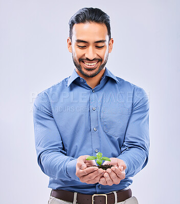 Buy stock photo Development, sustainability and businessman happy with growth isolated in a studio white background with plant. Palm, startup and entrepreneur with soil and plant as an investment or climate change