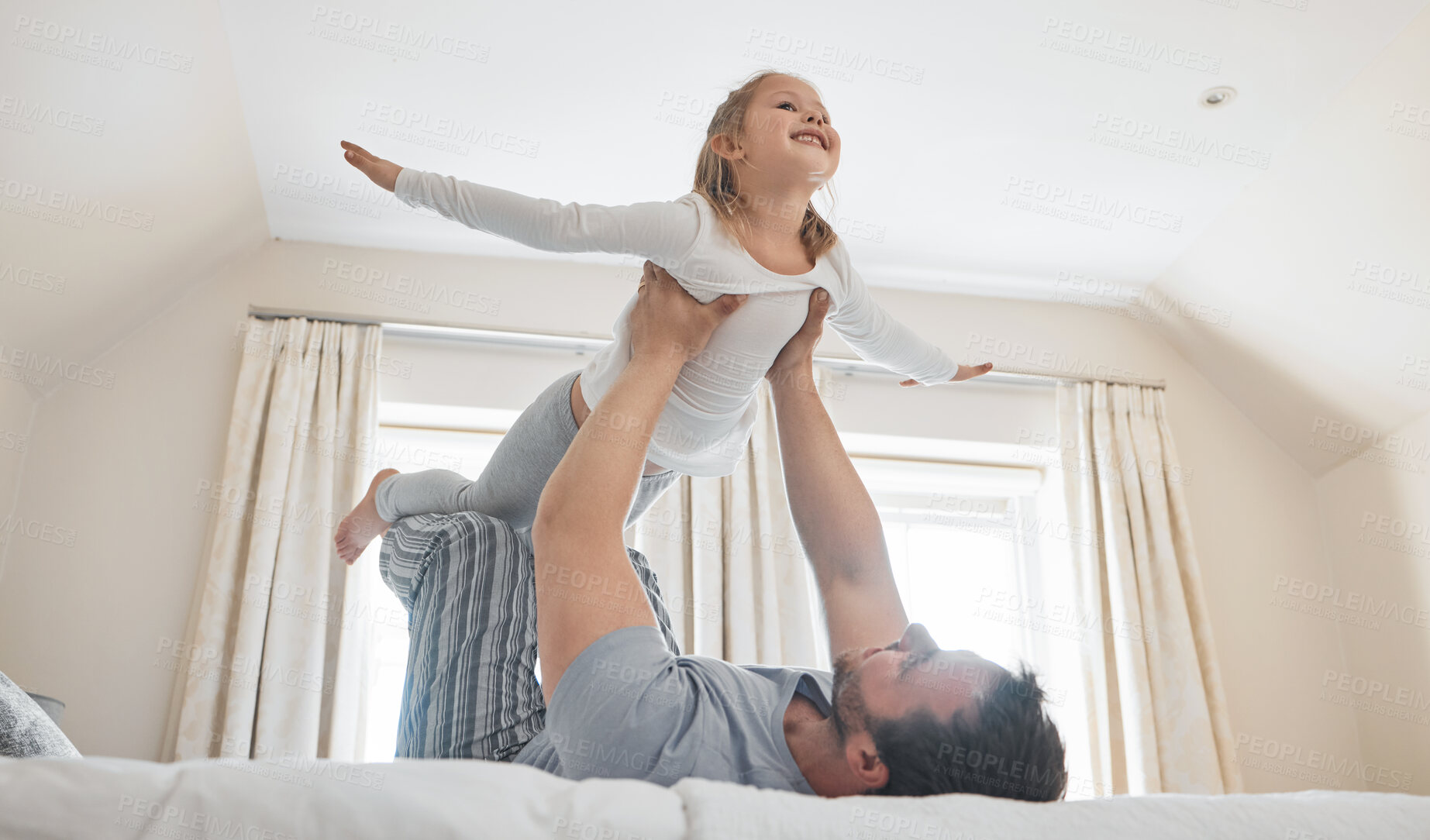 Buy stock photo Child, dad and happy on bed for airplane games, support and relax for crazy fun in house. Father, girl kid and excited to fly in bedroom for freedom, fantasy and balance for play, trust and energy