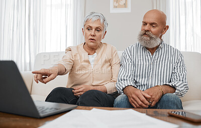 Buy stock photo Budget, finance and senior couple with laptop planning financial investments, mortgage or tax papers. Elderly woman apeaking of bills, debt and pension fund on bank statement with an old man at home 