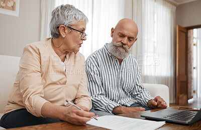 Buy stock photo Budget, documents and senior couple with laptop planning financial investments, mortgage or tax papers. Elderly woman speaking of bills, debt and pension fund on bank statement to an old man at home 