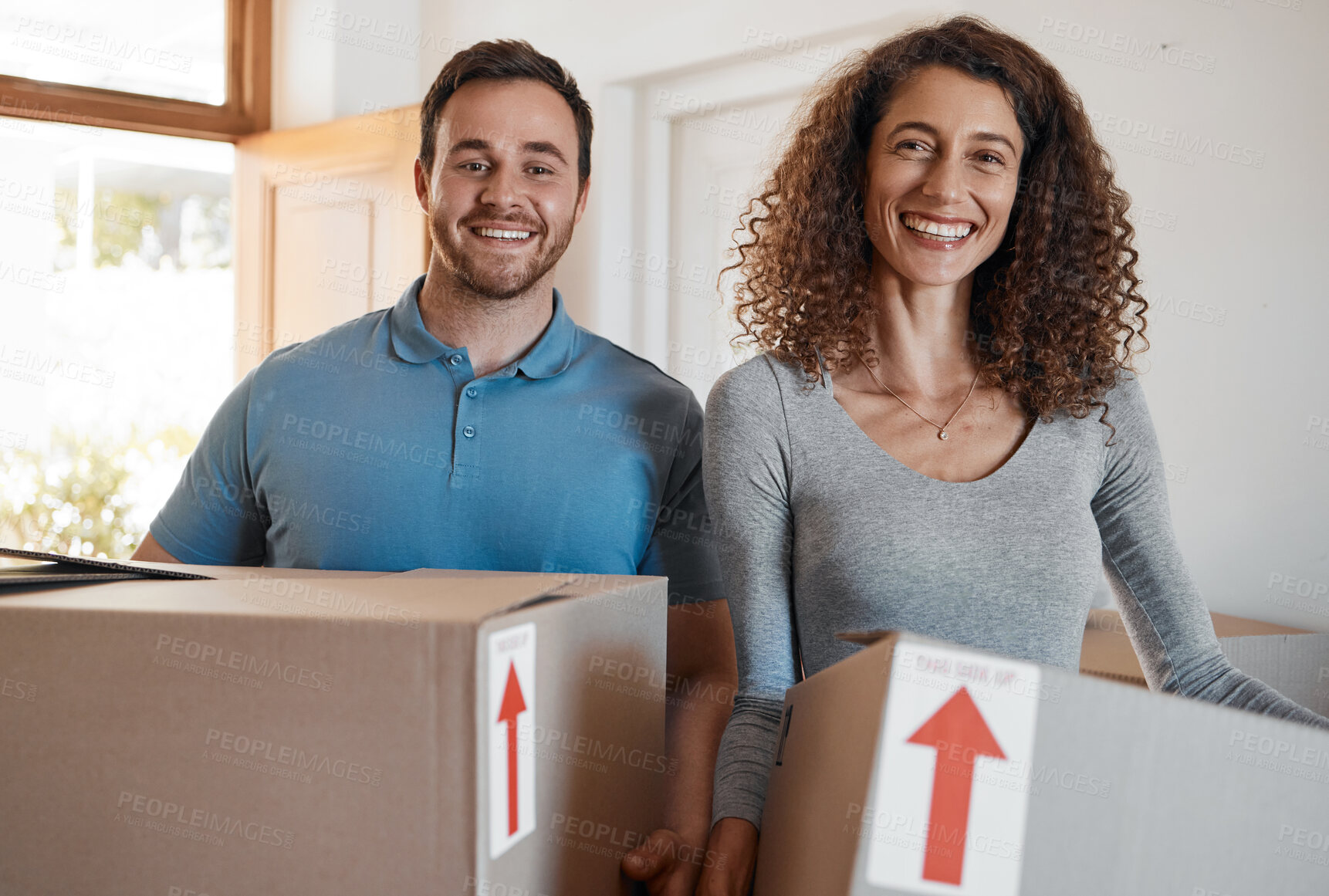 Buy stock photo Moving, new home or portrait of happy couple with boxes in real estate, property or rental apartment. Woman, proud man or excited people carrying or lifting package in a house on loan with smile