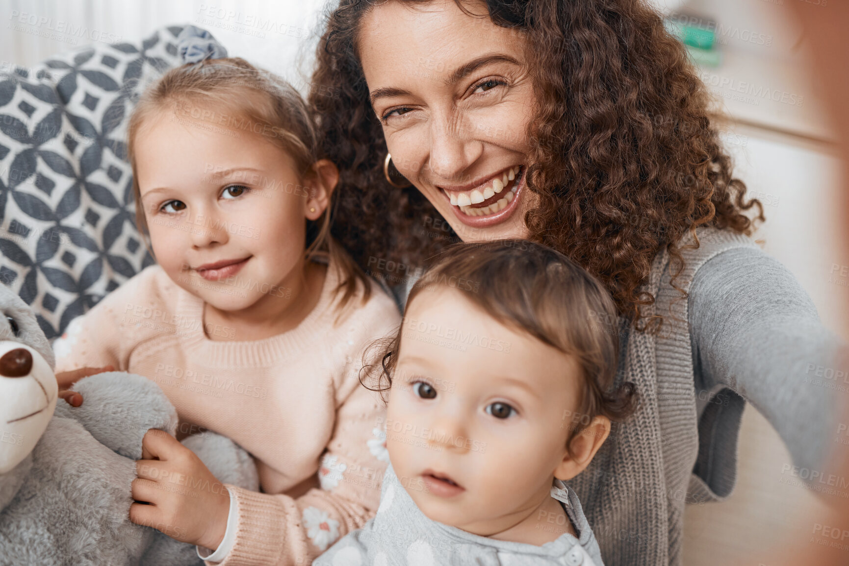 Buy stock photo Selfie, smile and portrait of mother with her children bonding, relaxing and playing in the living room. Happy, love and young mom taking a picture with her kids for memory together in lounge at home