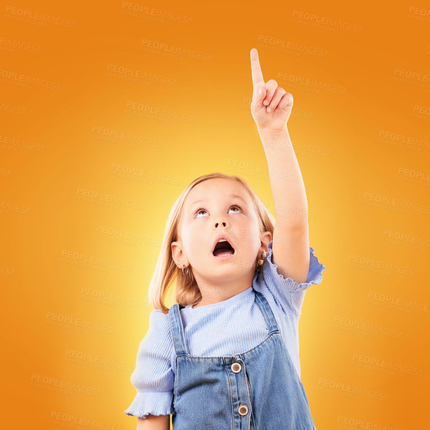 Buy stock photo Child, surprise and pointing up with hand in studio for advertising, announcement or promotion. Shocked girl kid on a orange background for gesture, mockup space or sign for attention, fear or scared