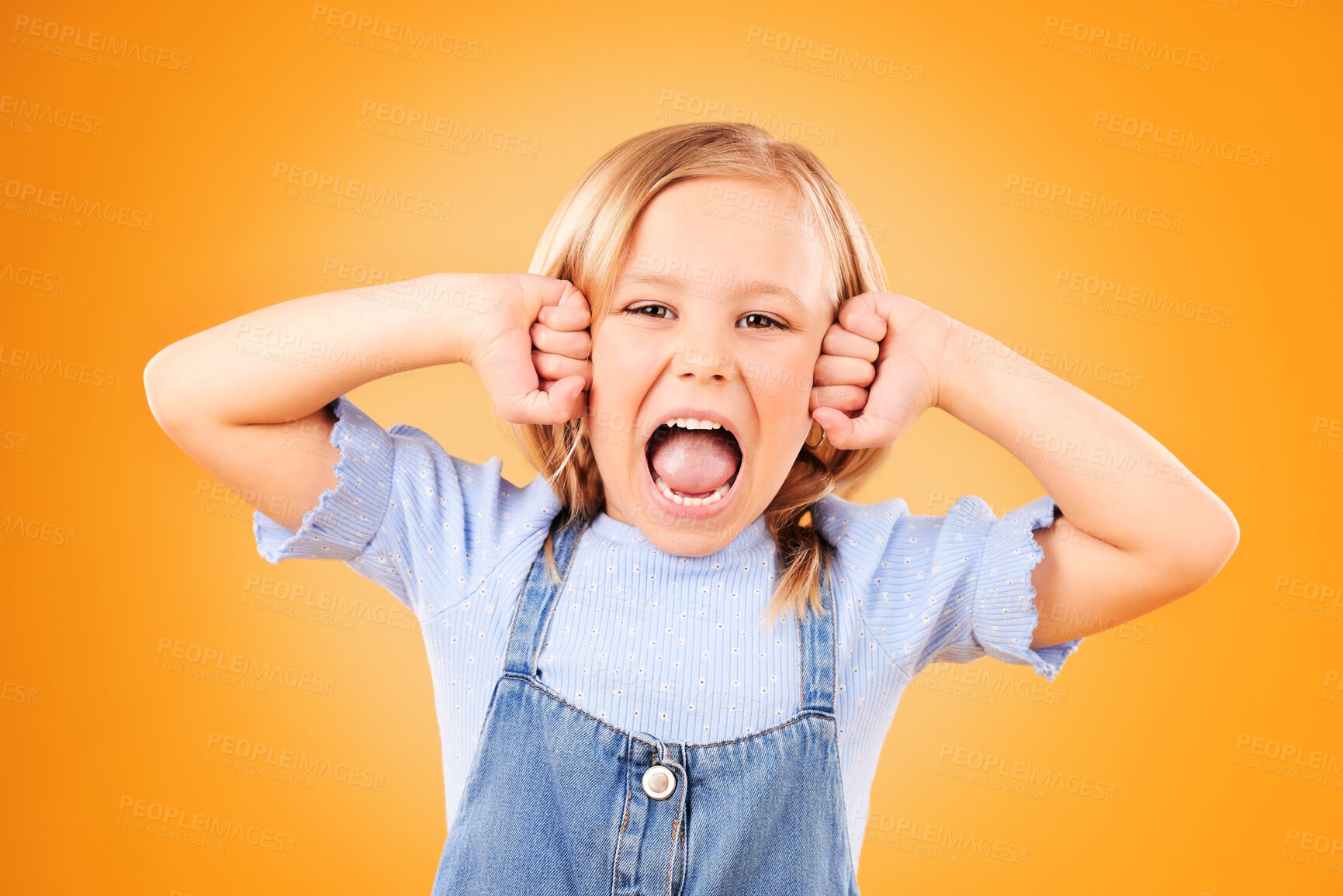 Buy stock photo Portrait, girl and kid with anger, screaming or emoji with emotion on a yellow studio background. Face, person or model with stress, frustrated or shouting with a child, facial expression or attitude