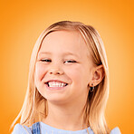 Happy, smile and portrait of girl on orange background with happiness, joy and excited in studio. Confidence, childhood and face of young, adorable and cute child with smile for positive attitude