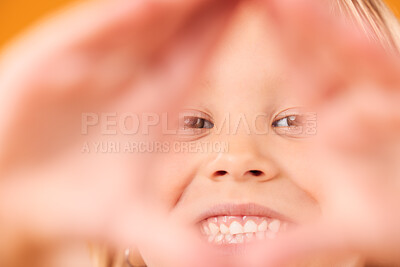 Buy stock photo Girl child, triangle hands and studio portrait with smile, excited and sign language by yellow background. Female kid, pyramid icon and face with frame, happy and closeup for diamond, symbol or emoji