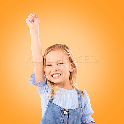 Buy stock photo Hand up, portrait and girl child in studio happy, excited and celebrating success on orange background space. Face, smile and kid winner with victory fist for good news, promotion or prize giveaway