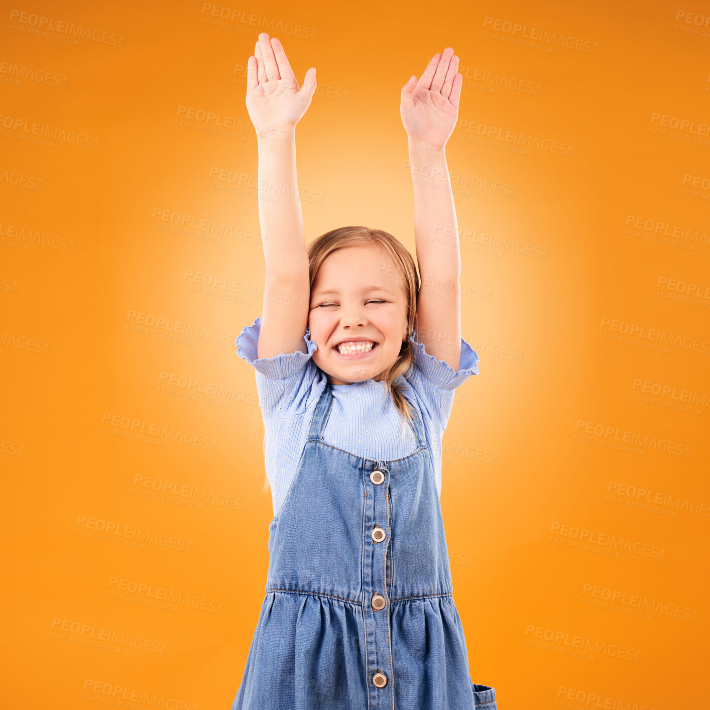 Buy stock photo Excited, celebration and girl child with arms up in studio for success, winner or happy on orange background. Yes, news and kid with hands, smile and celebrating achievement, victory or announcement