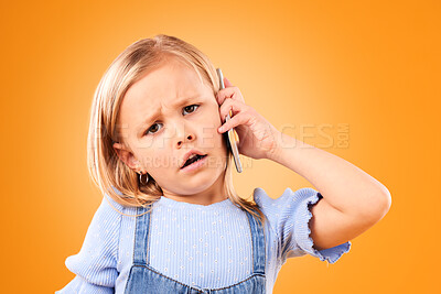 Buy stock photo Portrait, phone and a confused girl on an orange background in studio for a communication question. Face, mobile and doubt with a young female child looking unsure while chatting or speaking