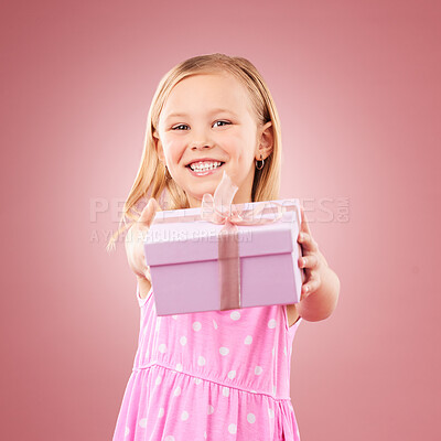 Studio, giving present portrait of a child for birthday, holiday or happy celebration. Excited girl kid on a pink background with ribbon on gift box for surprise, giveaway prize or celebrate kindness