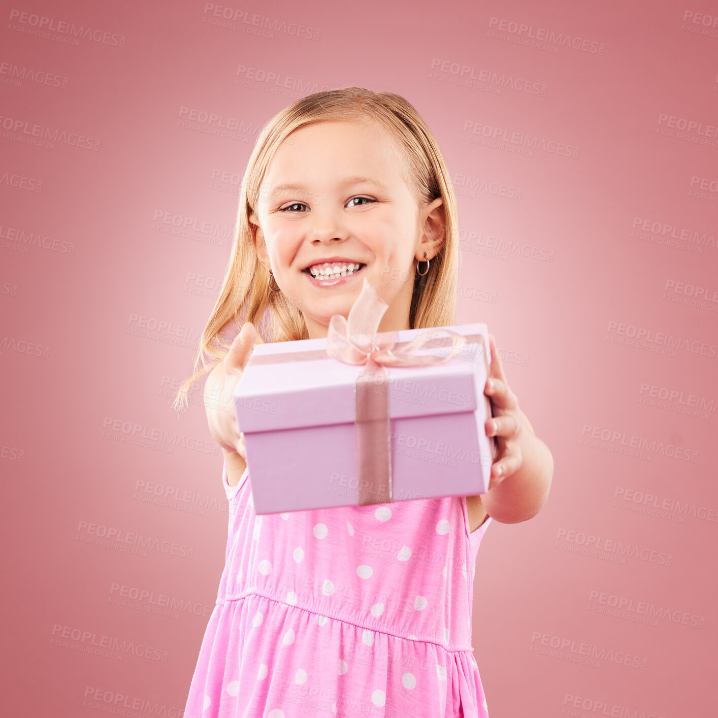 Buy stock photo Studio, giving present portrait of a child for birthday, holiday or happy celebration. Excited girl kid on a pink background with ribbon on gift box for surprise, giveaway prize or celebrate kindness