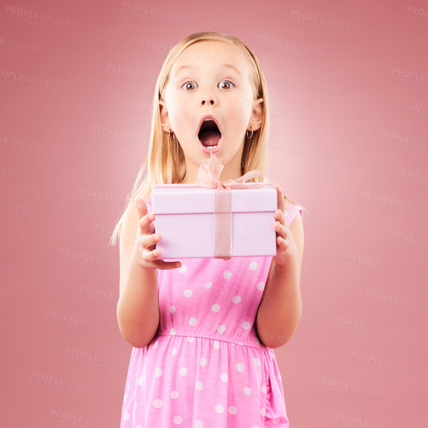 Buy stock photo Present, gift and wow portrait of a child in studio for birthday, holiday or happy celebration. Excited girl on a pink background with ribbon, mouth open and amazing surprise giveaway prize in box