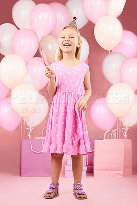 Buy stock photo Balloons, birthday and portrait of girl on pink background for party, celebration and special day. Happy, excited and young child with presents, gift box and lollipop for event decoration in studio