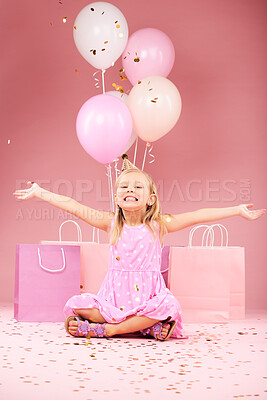 Balloons, birthday and portrait of excited girl on pink background for party, celebration and event. Happy, confetti and young child with open arms for presents, gift box and decoration in studio