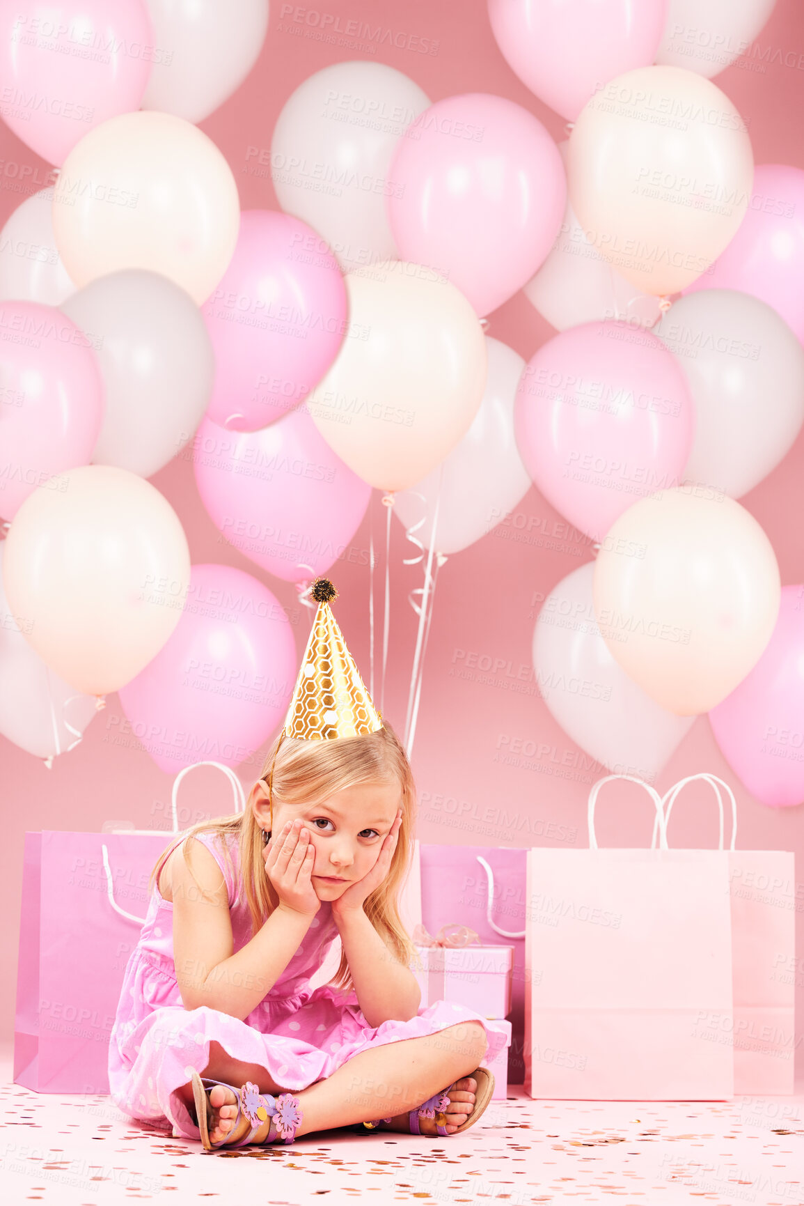 Buy stock photo Depression, sad birthday and portrait of girl on pink background for party, celebration and event in studio. Upset, emotion and unhappy, lonely and disappointed child with balloons, presents or gifts