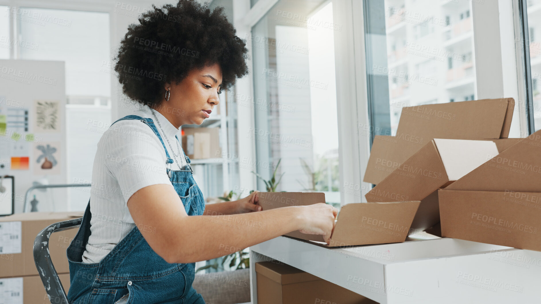 Buy stock photo Ecommerce, woman packing boxes in office for sales and delivery, seller working at creative startup. Online shopping, package and small business owner with product, stock or retail store on internet.