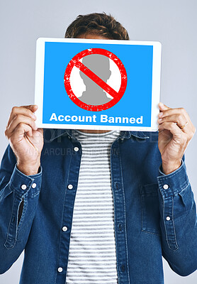 Buy stock photo Banned, account and man with a sign for social media, guidelines and rules for online profile and poster in studio background. Internet, ban and person with a banner in hands for virtual exclusion