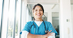 Portrait, healthcare and trust with a nurse woman in scrubs standing arms crossed while working in a hospital. Medical, health and insurance with a female medicine professional at work in a clinic