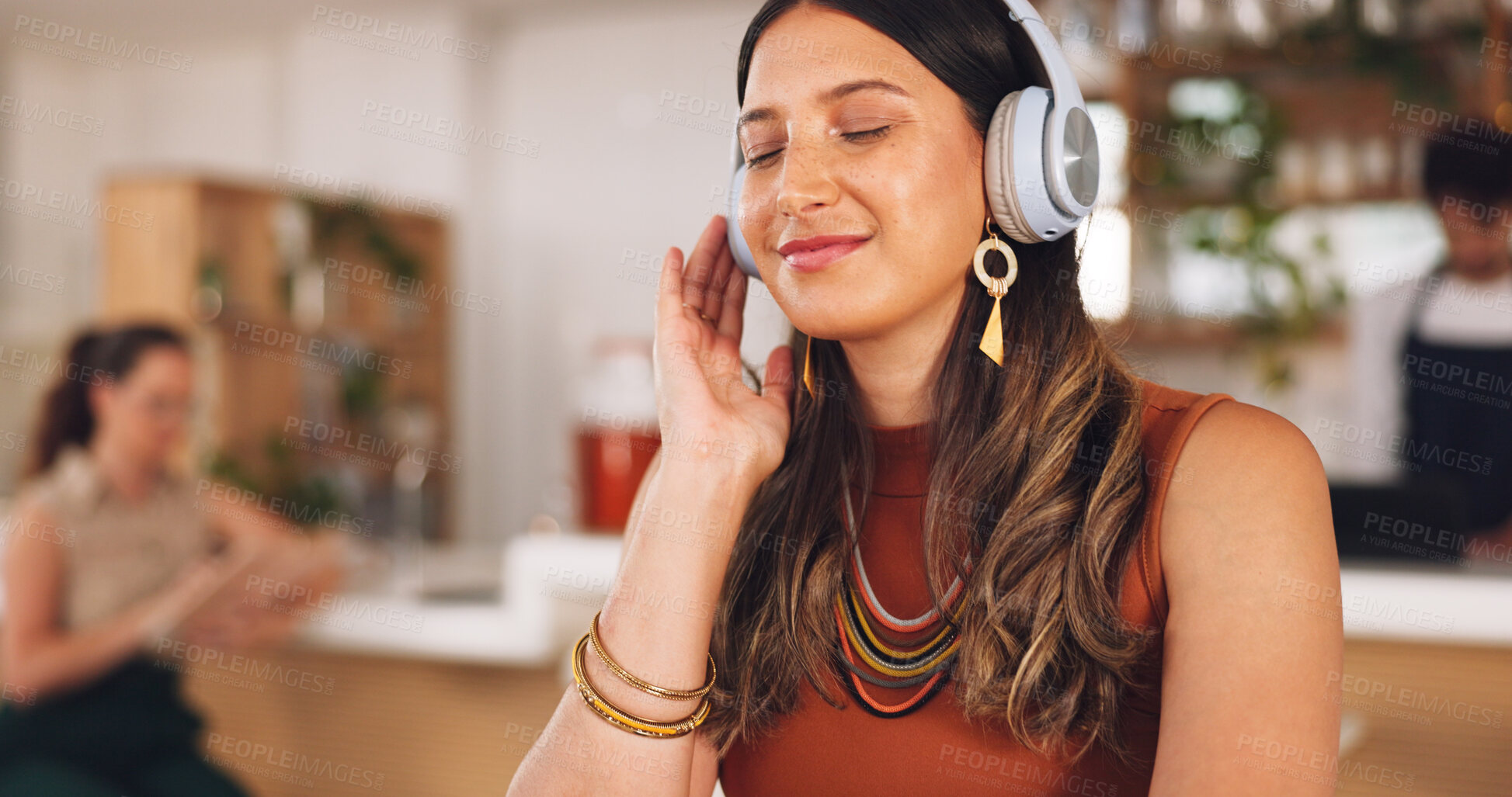 Buy stock photo Music, freelance and woman in coffee shop with headphones, connection and streaming with smile. Relax, technology and remote work, happy girl in cafe listening to audio, radio or motivation podcast.