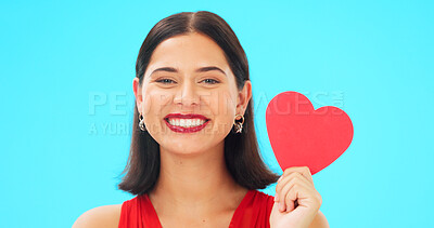 Buy stock photo Portrait, happy and woman with paper heart in studio isolated on a blue background mockup space. Face smile, romance and model with love sign for anniversary symbol, emoji and care on valentines day