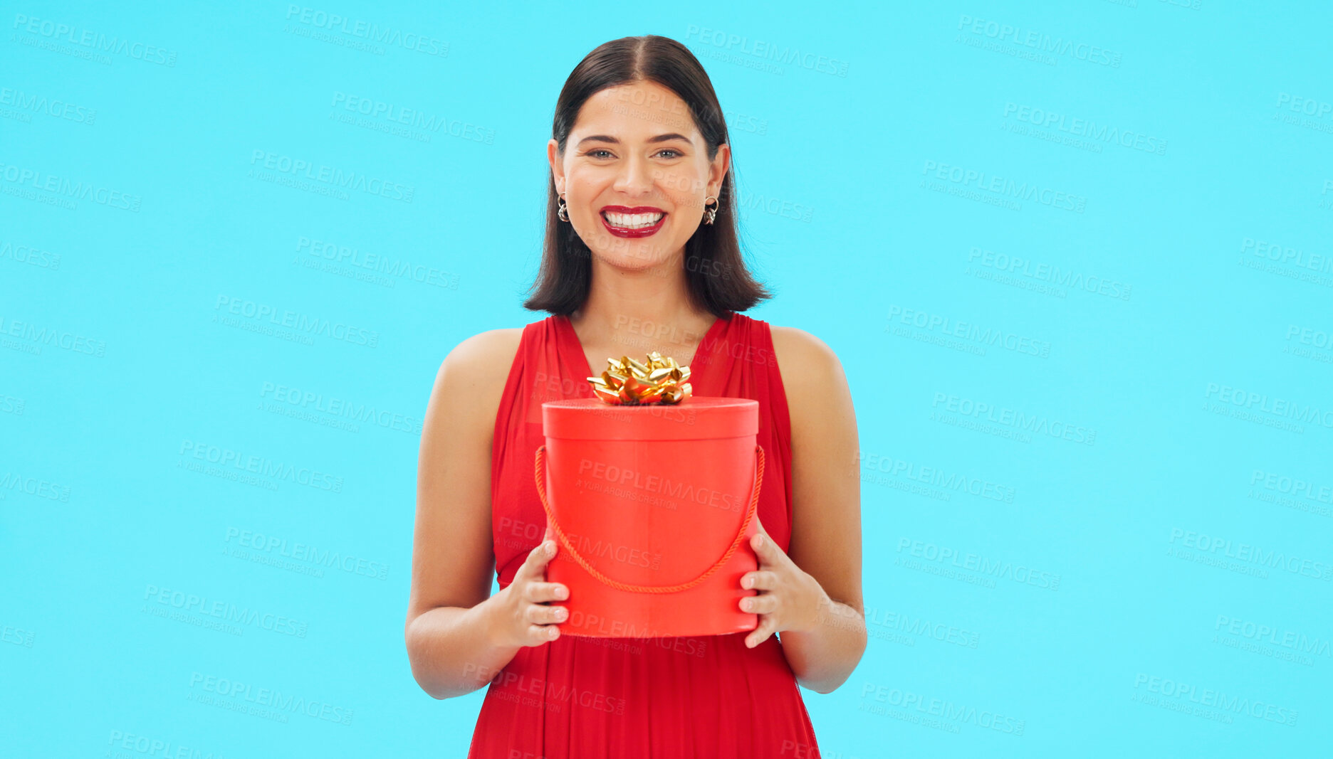 Buy stock photo Birthday present, excited and woman in portrait in studio, celebration and giveaway isolated on blue background. Happiness, smile and winning with gift box, party with reward or bonus prize 