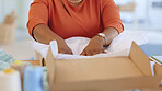 Black woman, hands and box in logistics for delivery, ecommerce or shipping cargo at office desk. Hand of African American female in small business packing product for shipment or courier service