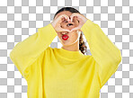 Woman, portrait and heart hands for love, care or romance in casual fashion against a grey studio background. Female person with loving emoji, hand gesture or sign and symbol for healthy wellness