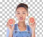 Portrait, kiss and woman with grapefruit in studio isolated on a blue background. Face, fruit and person with food for healthy diet, nutrition or wellness, eating and vitamin c, benefits and vegan.