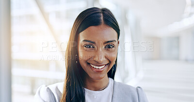 Face, smile and corporate with a business woman in the office for a professional internship. Portrait, confident and happy young female indian employee standing in the office for career satisfaction