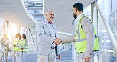 Businessman, architect or handshake for partnership, deal or agreement in construction in building. Mature CEO shaking hands with contractor or engineer for b2b, hiring or architecture recruitment