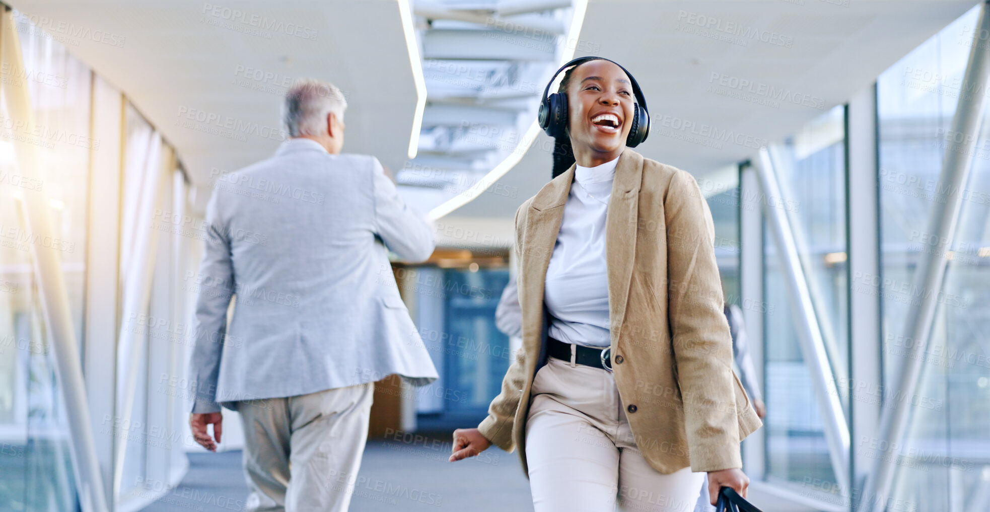 Buy stock photo Business, airport and black woman with headphones, dance and celebration with a smile, joy and streaming music. African person, happy employee or consultant with a headset, lobby and audio with radio