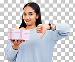 Disappointed, portrait and woman with a thumbs down for a gift isolated on a yellow background. Unhappy, negative and a girl holding a present and showing a hand gesture for disappointment in studio