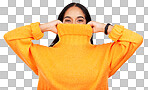 Happy, cover and portrait of a woman with a jersey isolated on a yellow background in a studio. Hiding, winter and a girl holding a jumper up for covering, warmth and bad weather on a backdrop