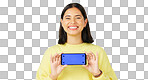 Happy woman, phone and mockup on green screen with tracking markers for advertising against studio background. Portrait of female with smartphone display for advertisement or marketing on copy space