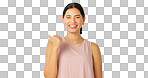 Woman face, pointing and green screen with happiness and smile showing mockup for advertisement. Portrait, isolated and studio background with a happy young female point to show mock up announcement