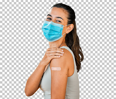 Mixed race covid vaccinated woman showing plaster on arm, wearing surgical face mask. Portrait of hispanic woman isolated against yellow studio background with copyspace. Protected with corona vaccine