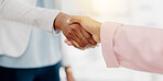 Business people, handshake and partnership for b2b, meeting or trust in teamwork at the office. Colleagues shaking hands in unity, deal or agreement for greeting, welcome or introduction at workplace