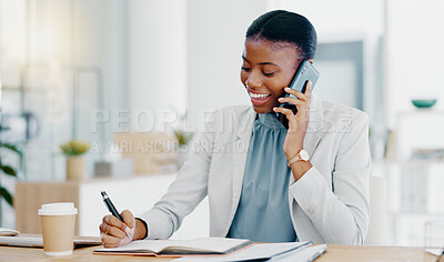 Black woman, phone call and writing in book consulting for financial advice, conversation or communication at office. Happy African female accountant talking on smartphone checking data on computer