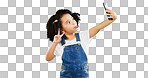 Silly little girl, selfie and peace sign on green screen with goofy facial expressions against a studio background. Female child or kid making funny face with hand sign for photo or vlog on mockup