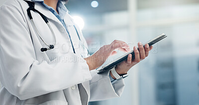 Tablet, typing and doctor hands for hospital or clinic management, healthcare software and research. Search, online services or night review of medical professional worker on digital technology