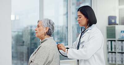 Senior woman, doctor and stethoscope on back to listen to lungs for breathing problem. Elderly, medical professional and person with cardiology tools for exam, consultation or healthcare in hospital