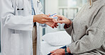 Healthcare, hands and a doctor with a patient and oximeter to check oxygen in the blood in a consultation. Hospital, help and a medical worker with gear and a person for health results at a clinic